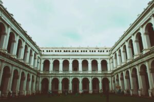 Exterior view of the historic Indian Museum in Kolkata showcasing classic colonial architecture with arches and columns.