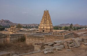 Explore the historic Virupaksha Temple in Hampi, a UNESCO World Heritage Site surrounded by stunning landscapes.